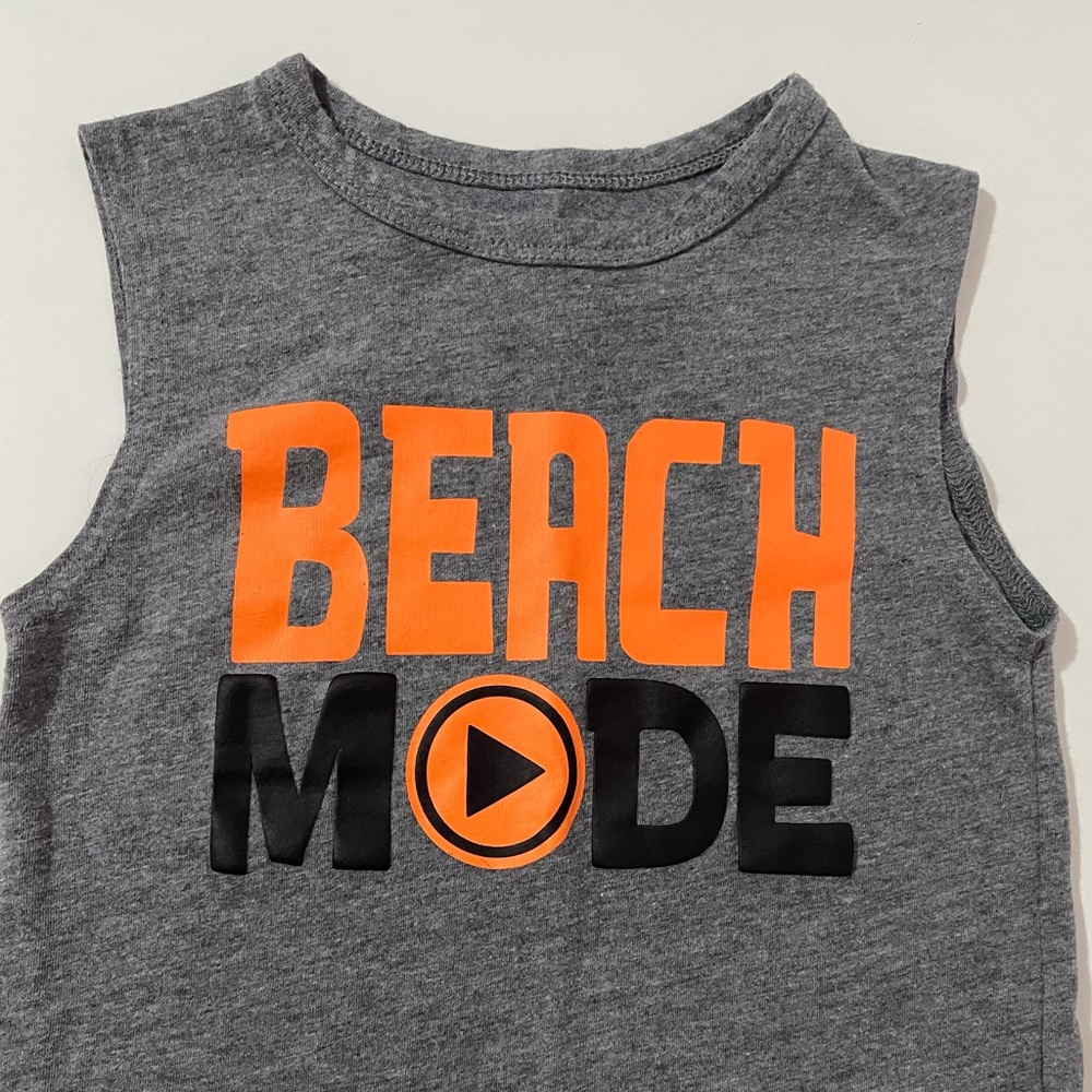 Two boys muscle shirts.